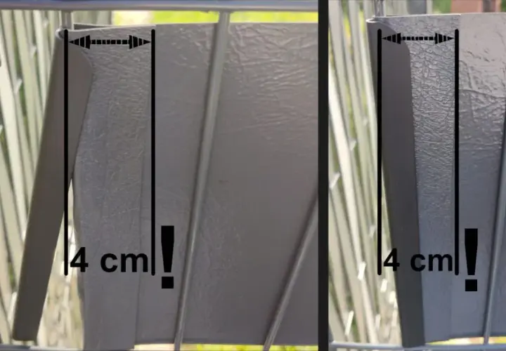 Szary panel ogrodzeniowy z zaznaczonym wymiarem 4 cm. Kluczowy element montażu taśmy ogrodzeniowej.